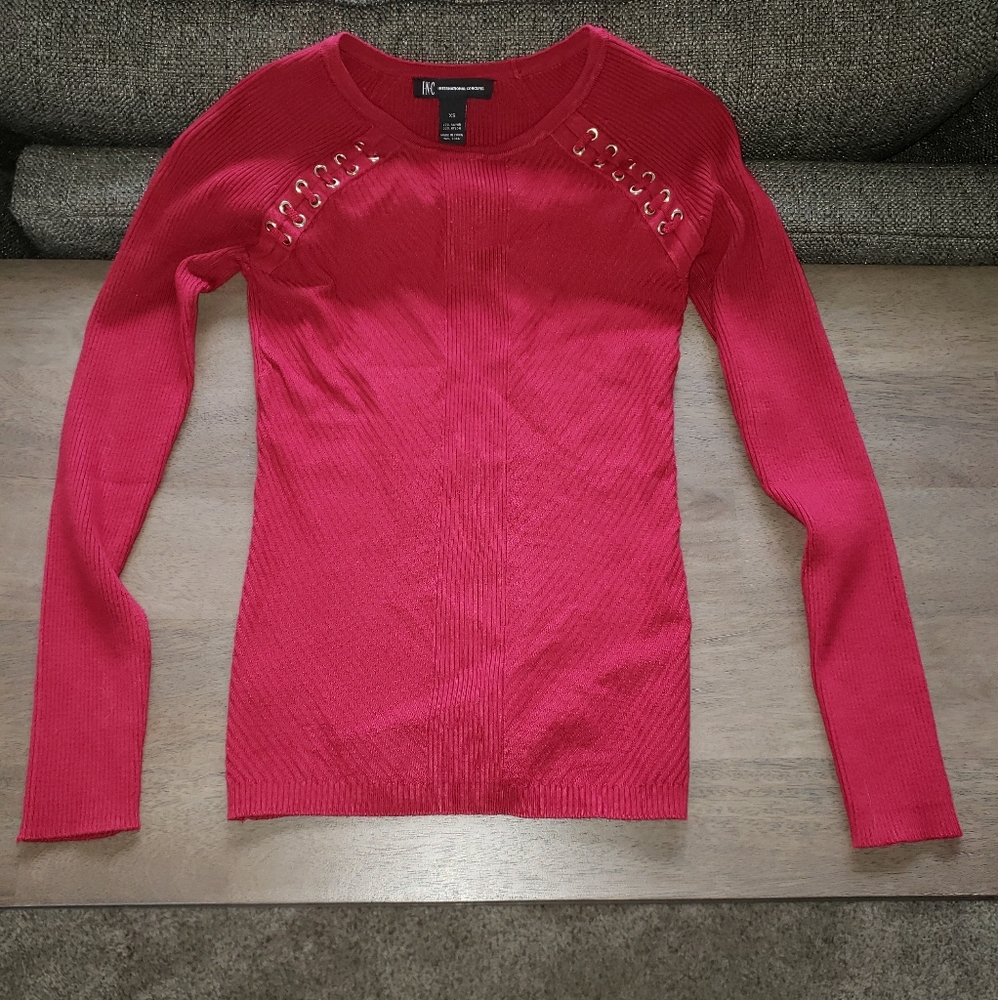 Red grommet details sweater